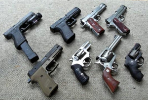 Clockwise starting at topleft:  Glock G22, Glock G21, Kimber Custom Raptor, Dan Wesson Commander, Smith & Wesson Air Weight .357, Ruger Blackhawk .357, Ruger SP101, Sig Sauer P220 Combat. Photo by: Joshuashearn